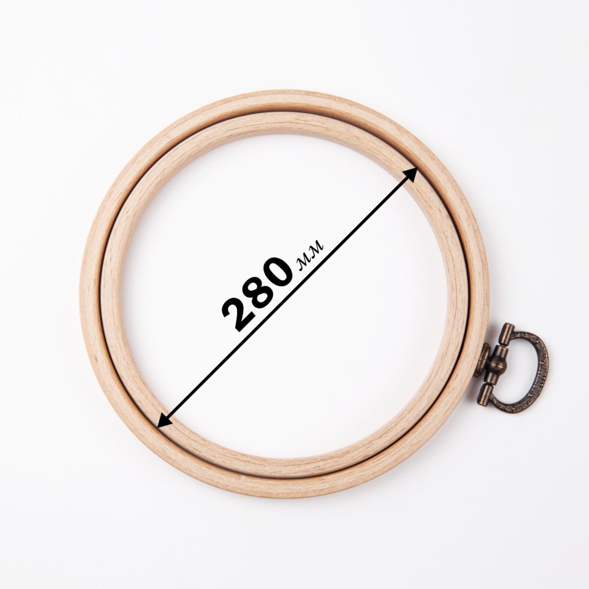 Nurge wooden frame with hook for display.