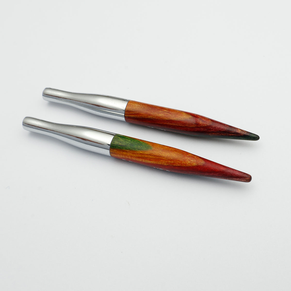 - KnitPro Symfonie 2 Mini interchangeable needle tips, 5 cm - Two wooden-handled tools with polished silver metal collars and dark tips, arranged diagonally on a plain white background.