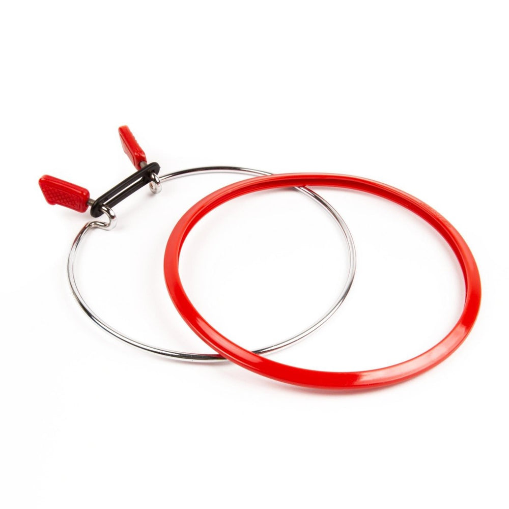 Nurge tension hoop with spring for secure embroidery or sewing.