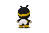 Completed Bee amigurumi on white background.